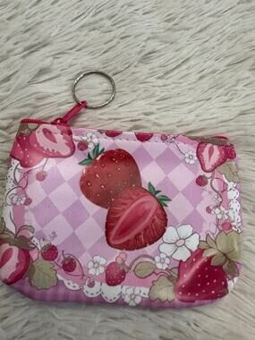 Pink & white strawberry-themed coin pouch keychain pink and white background